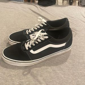 Black and white low top Vans
